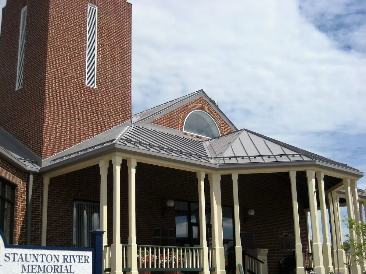 Skilled roofing craftsmen working on a residential roof in Mount Aetna